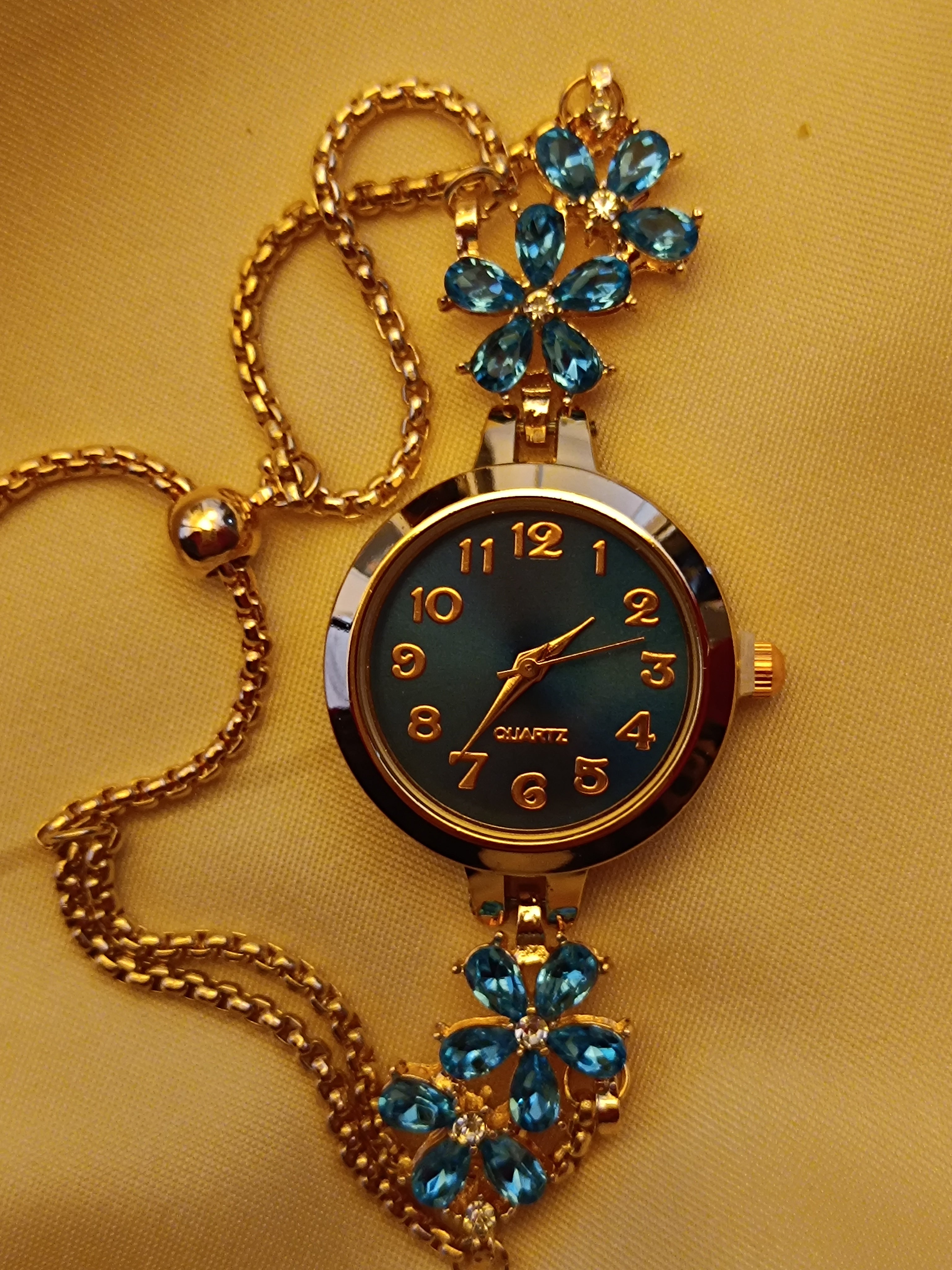 "Turquoise" - elegante Armbanduhr mit blauen Kristallblüten