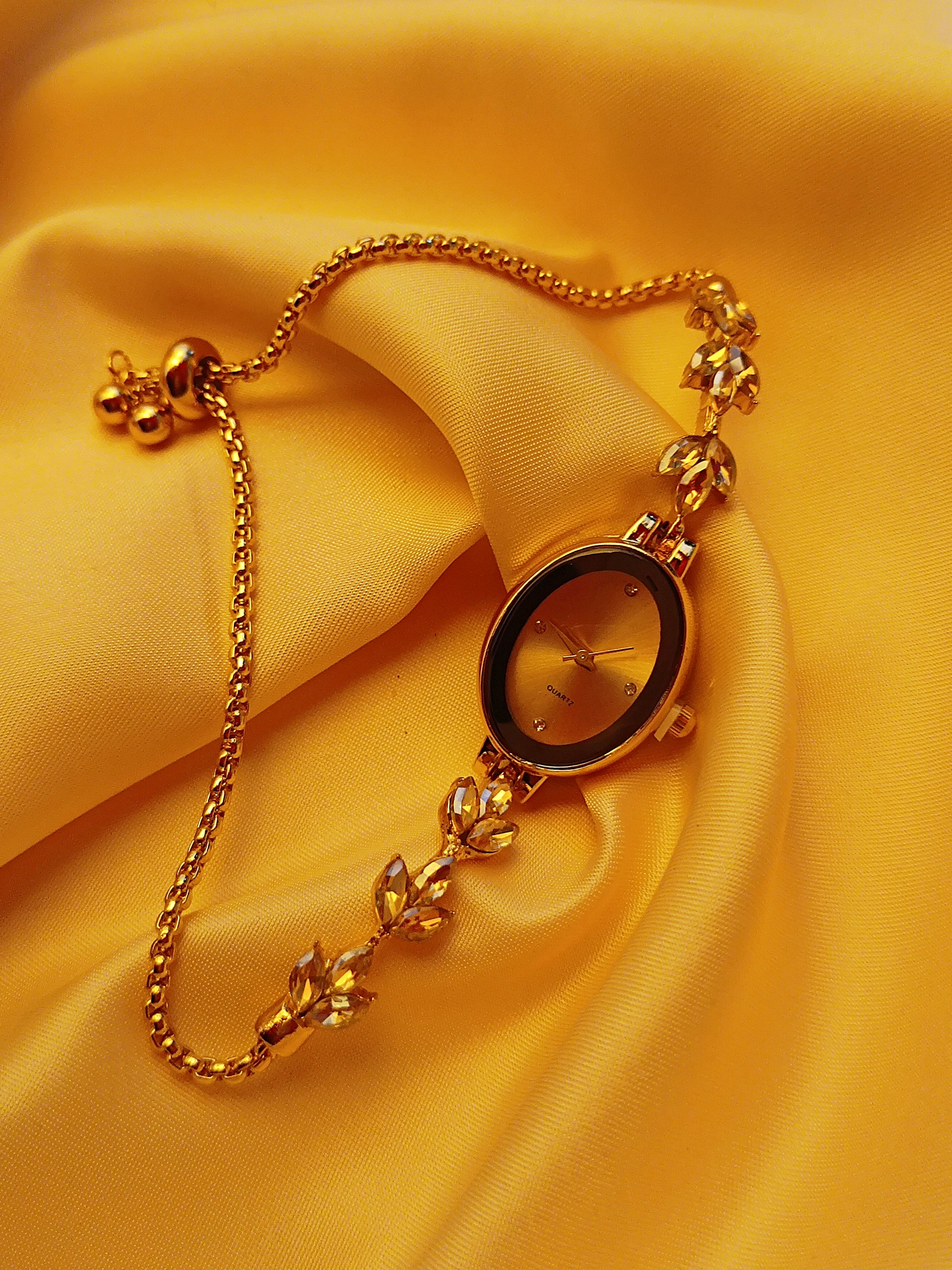"Crystal" - Elegante Damenuhr in Gold mit Kristallblüten