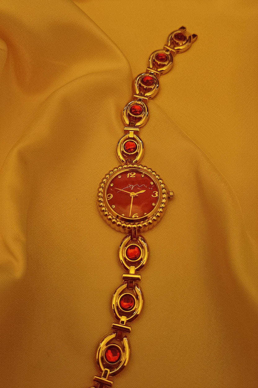 "Ruby" - Elegante Schmuckuhr in Gold mit roten Schmucksteinen