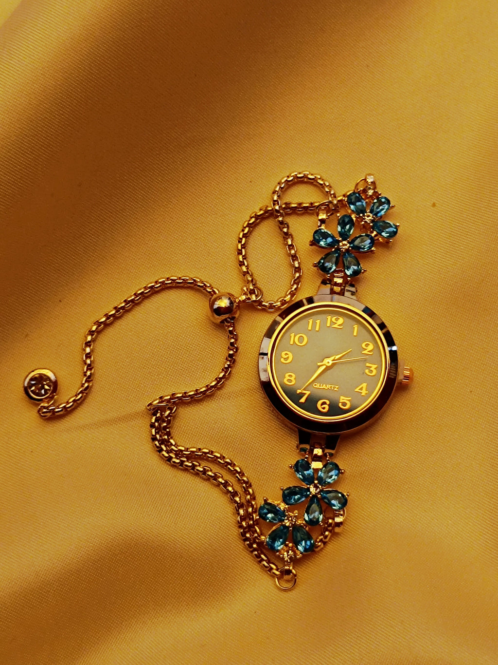 "Turquoise" - elegante Armbanduhr mit blauen Kristallblüten