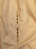 Emerald -  Goldene Schmuckuhr mit grün marmorierten Schmucksteinen